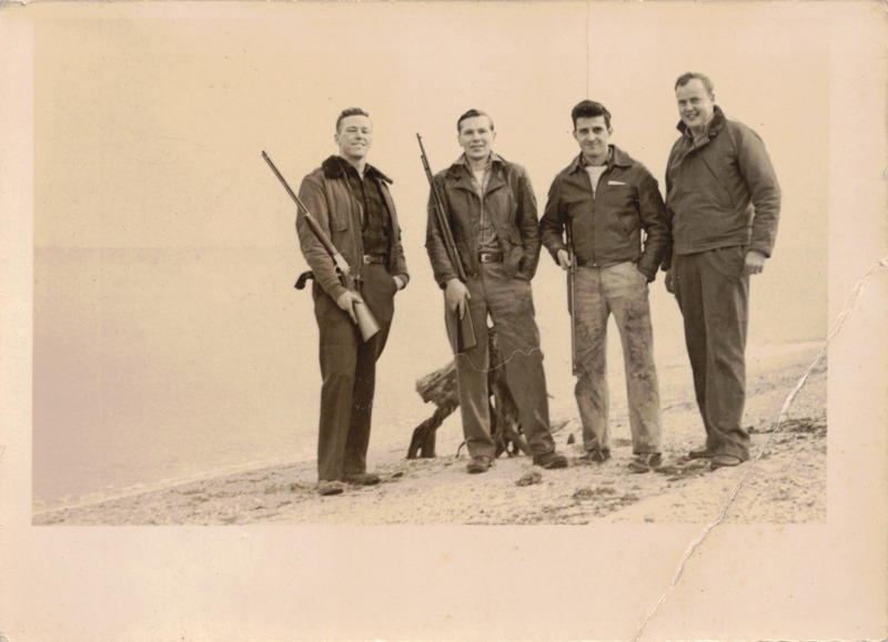 Carl Posed with Aviators on the Shore c. 1951
